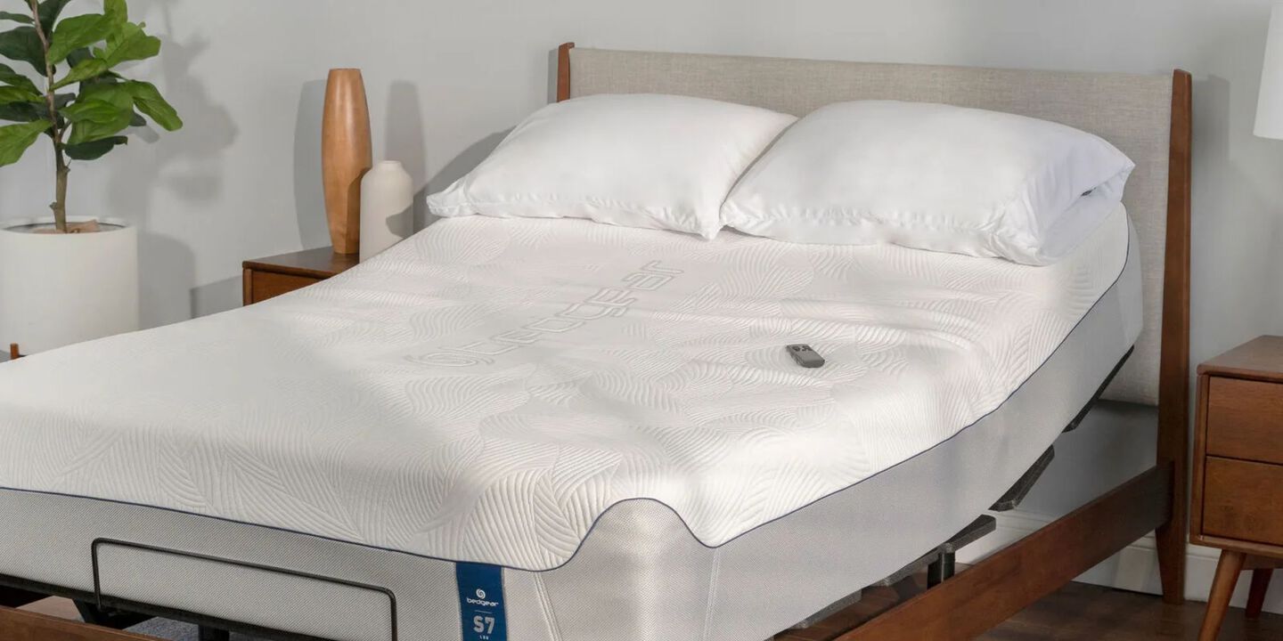 Mattress with white pillows on top of an adjustable base