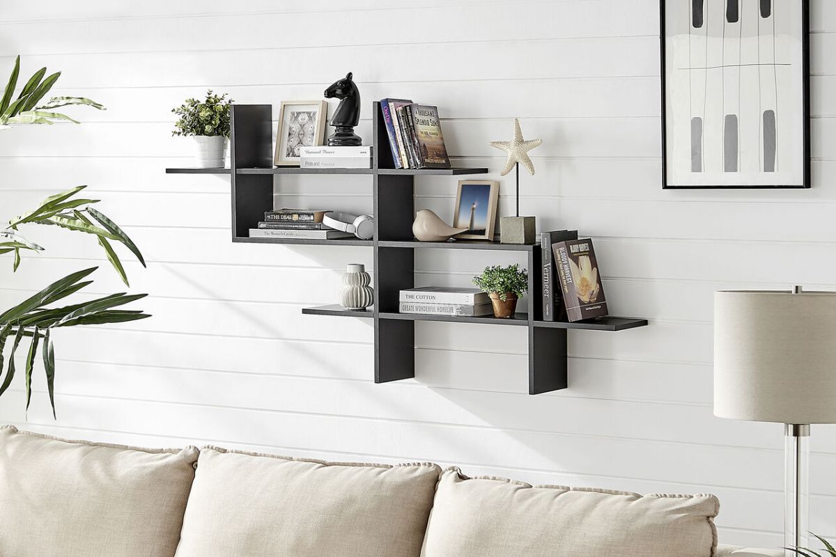 floating shelf on the white panel wall