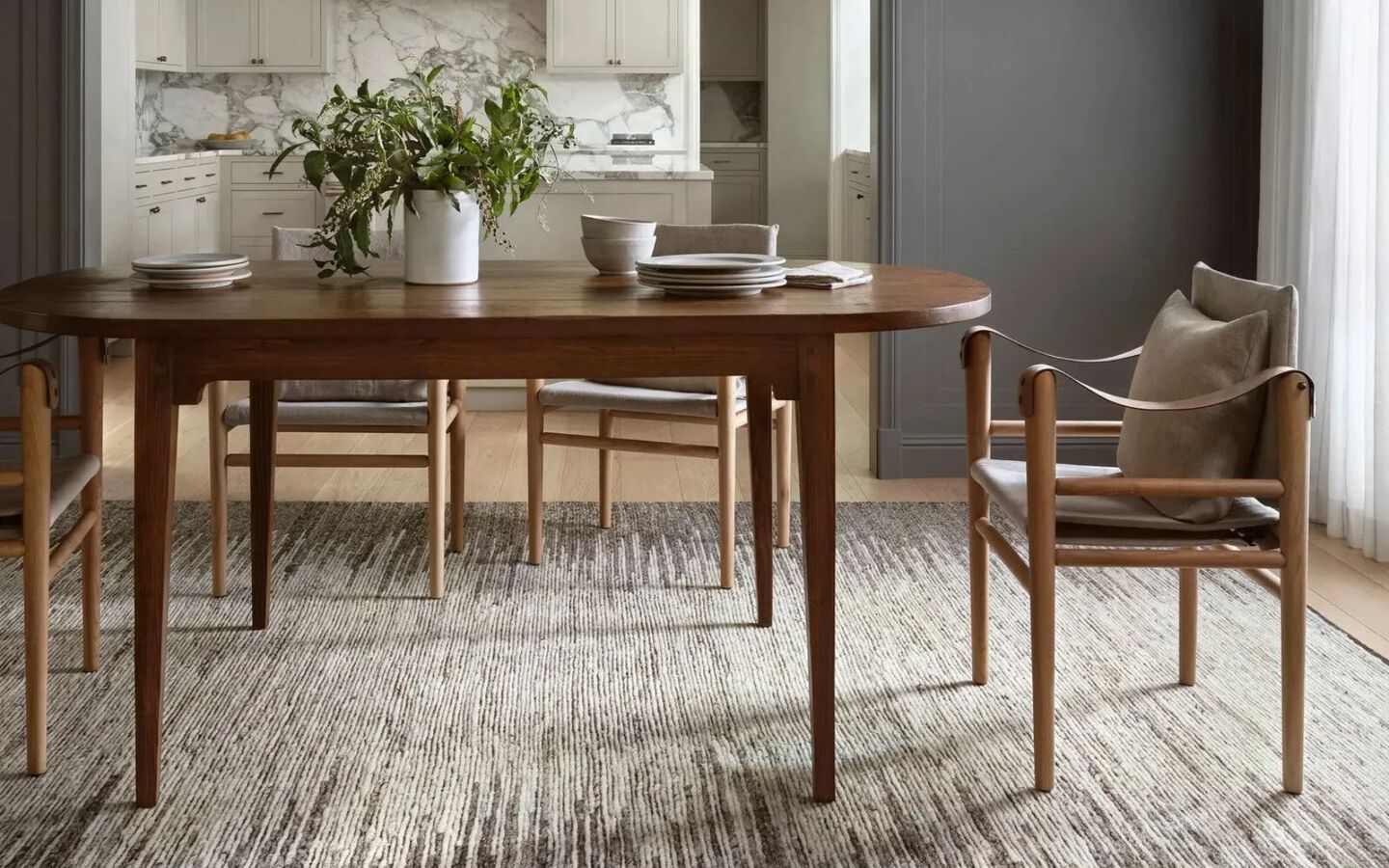 dining room setting with a grey patterned rug