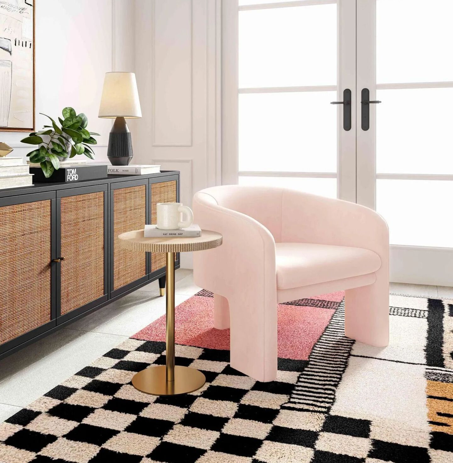 Light pink chair sitting on top of a black and white checkered rug