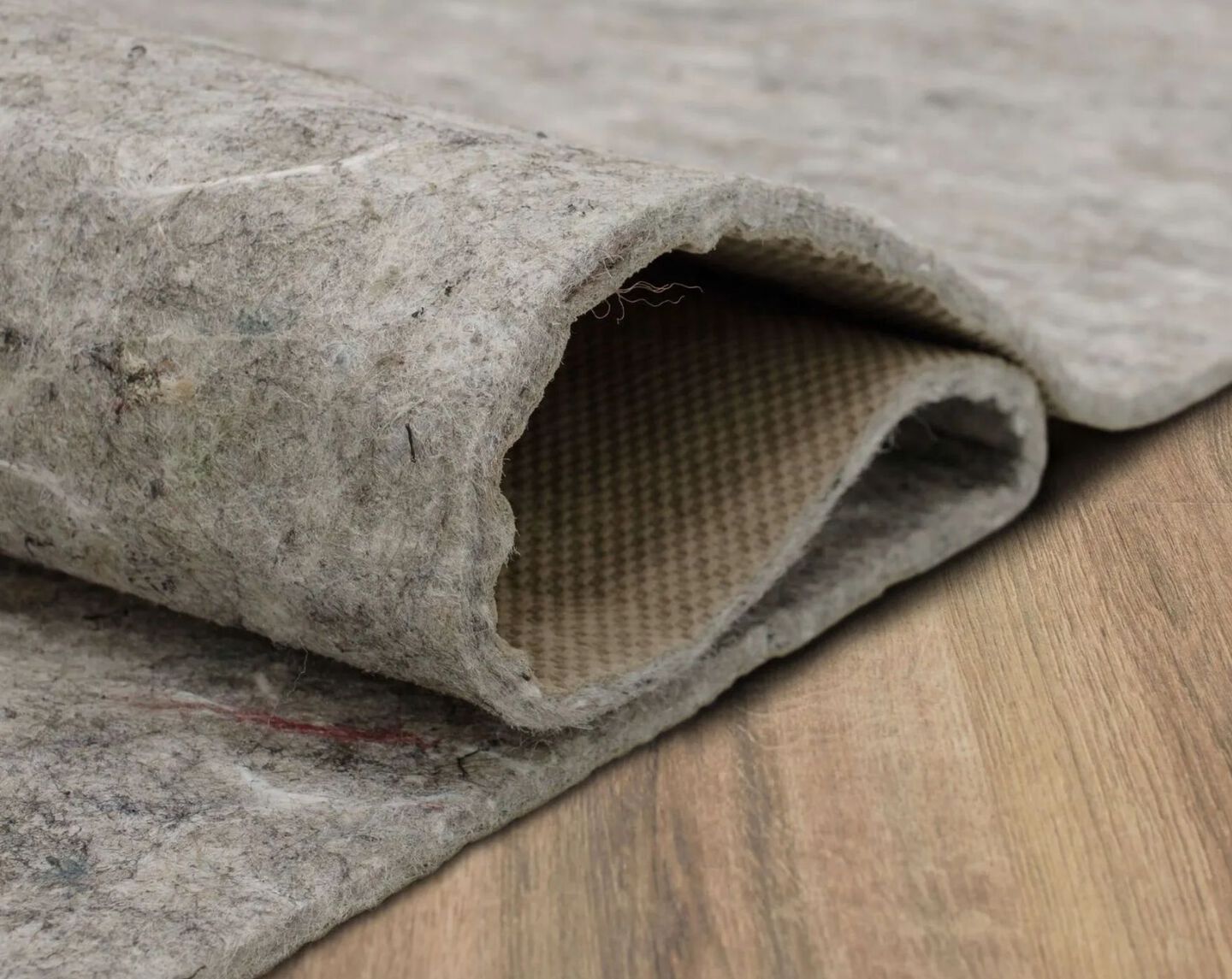 closeup image of a folded rug pad