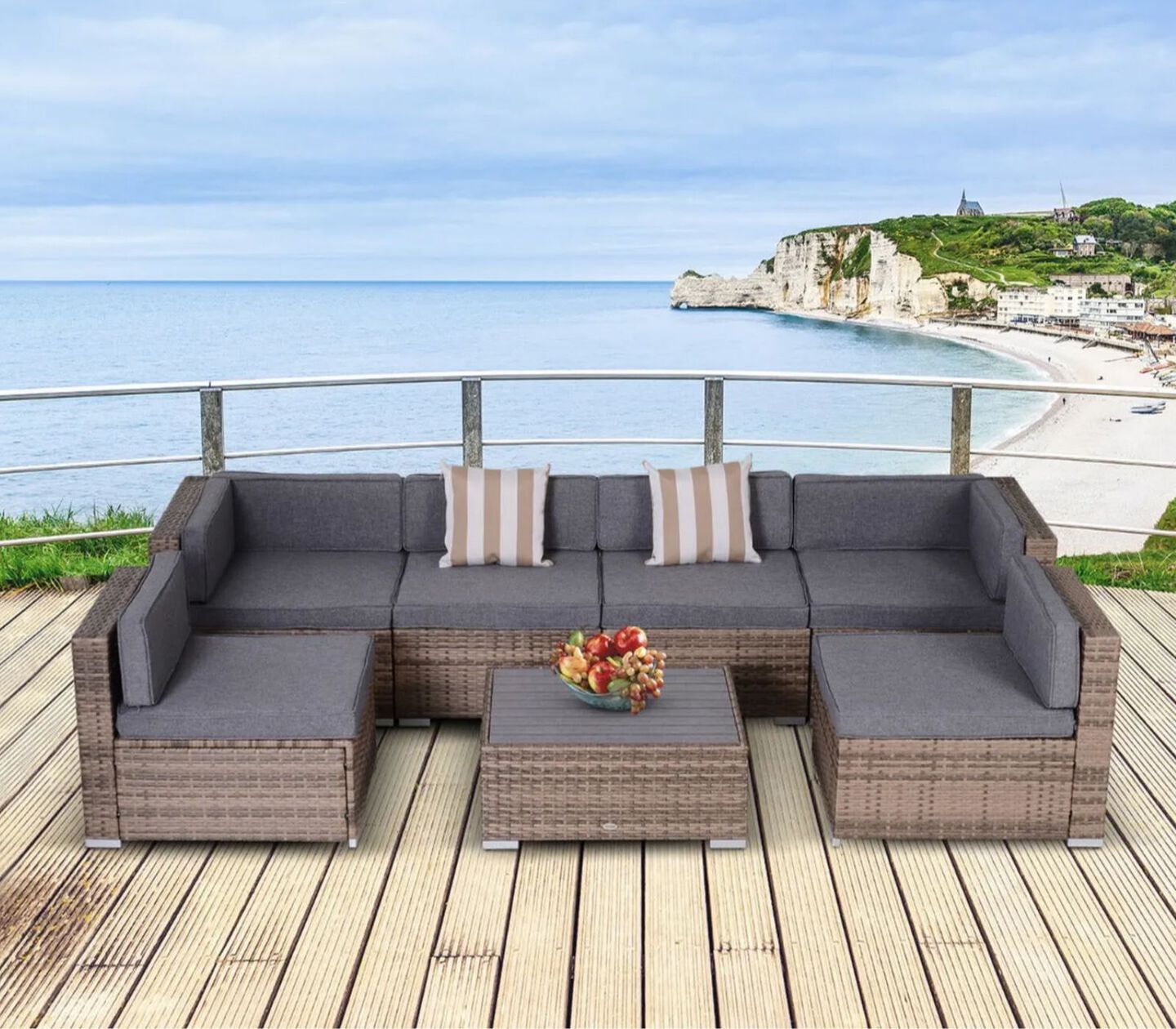 Grey and brown outdoor patio sectional and ottoman on a patio above a beach