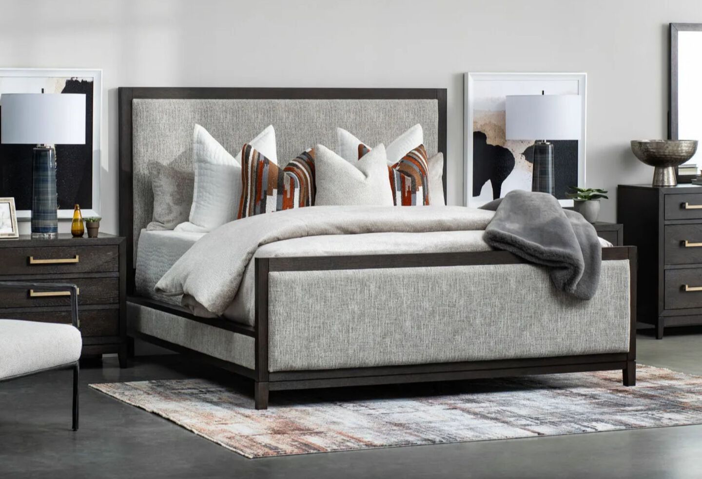 Bedroom with a grey and black bed and two black nightstands