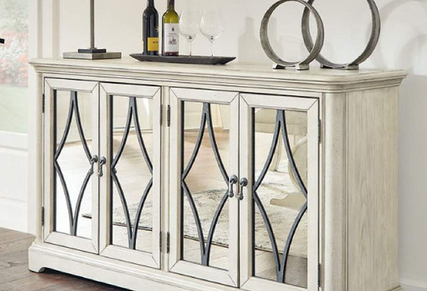 White wooden dining server with mirrors and detailing on the cabinet doors
