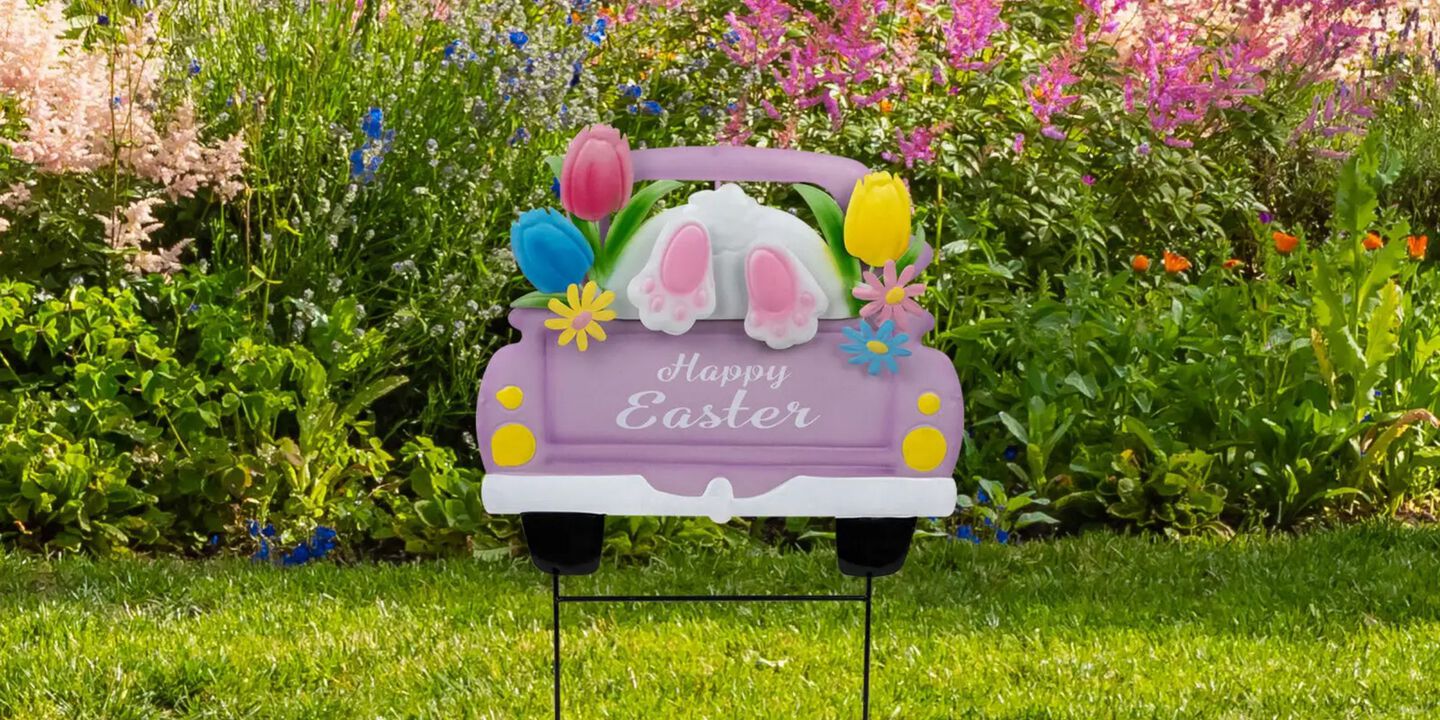 Yard with a "Happy Easter" sign in the grass