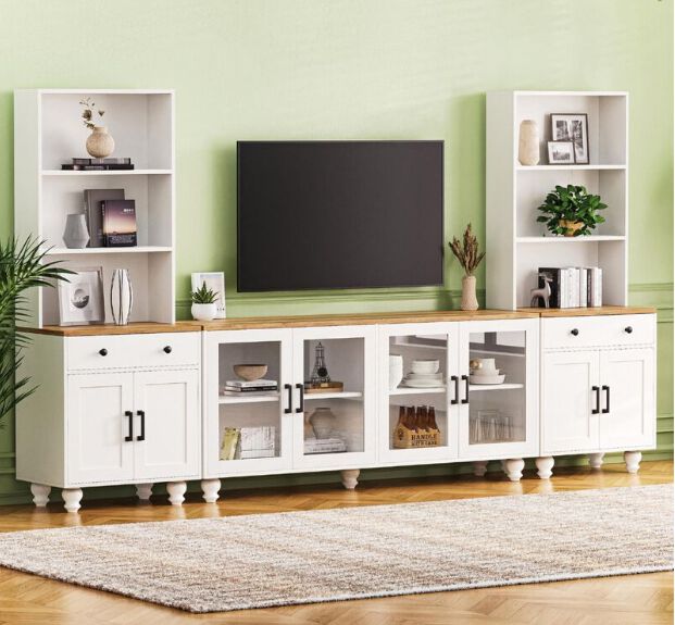 White entertainment center with a console as the base to two towers on each side.