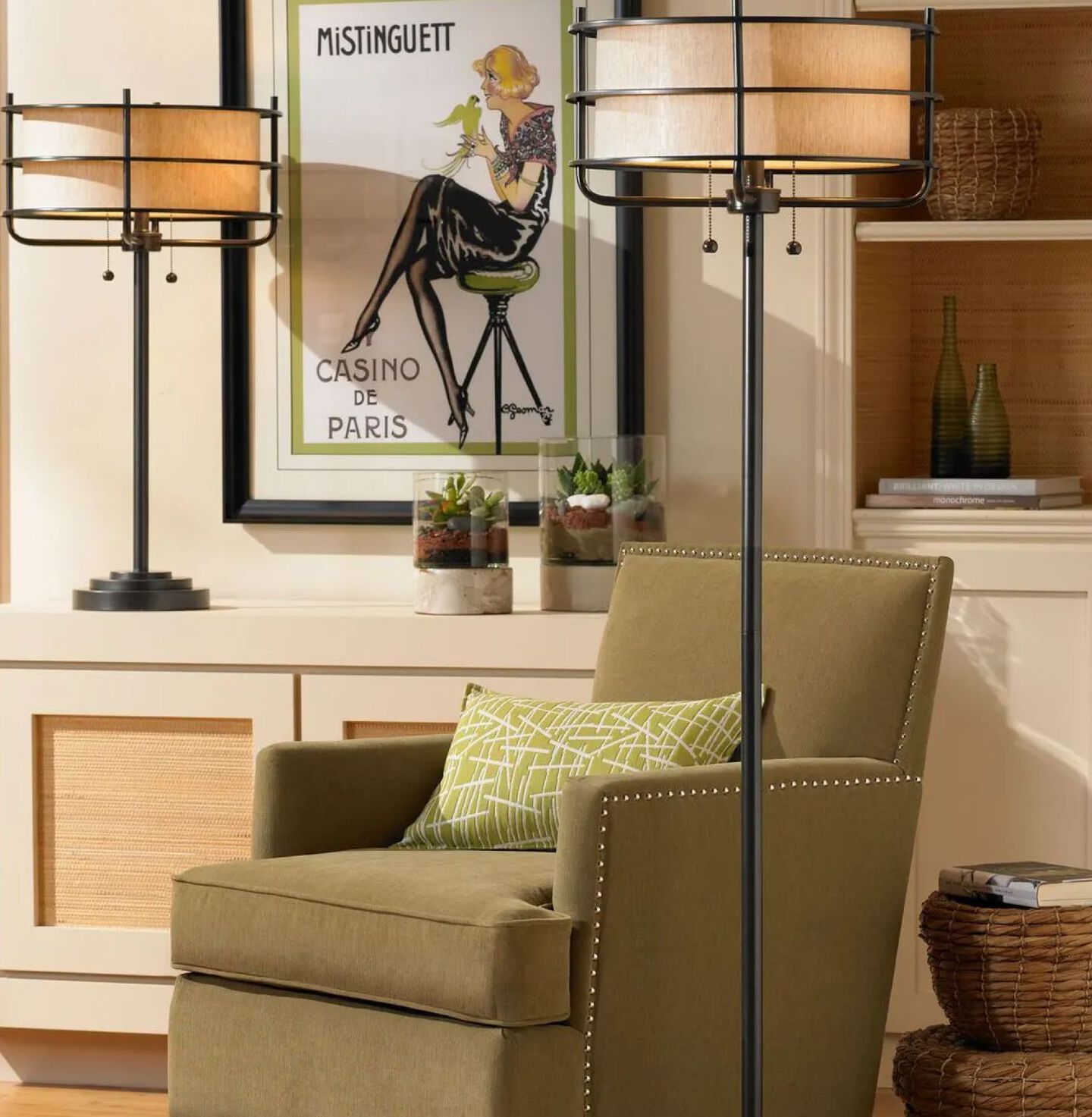 Living room with black and beige lamps and a green chair