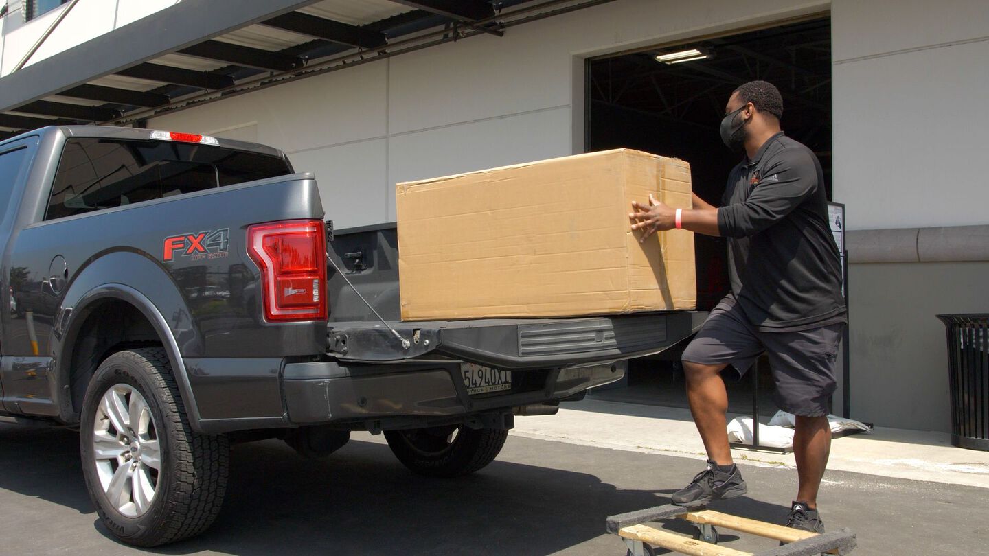 Mathis Home curbside pickup of an in-stock furniture order at a distribution center