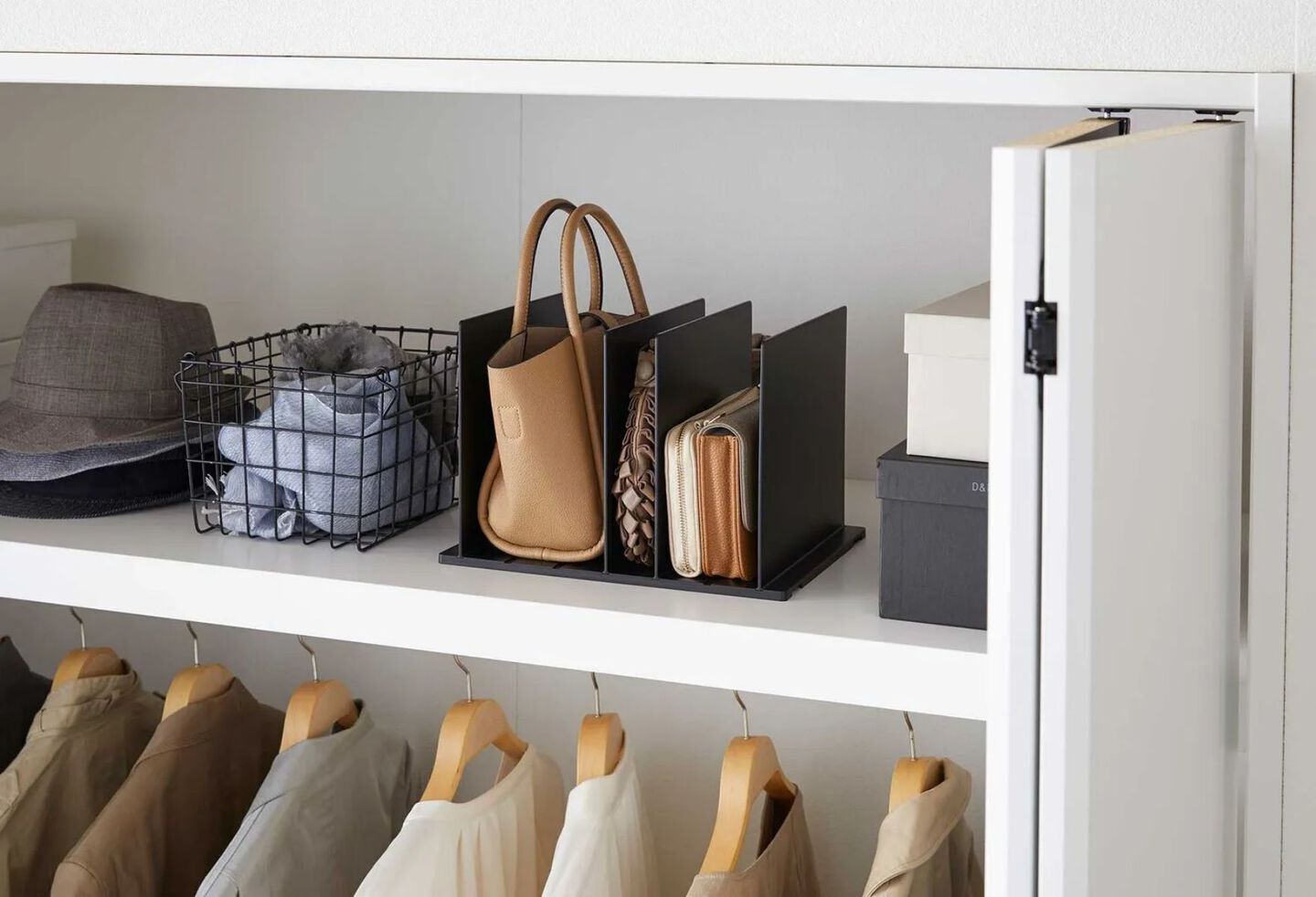 Closet shelf with a black purse organizer on top