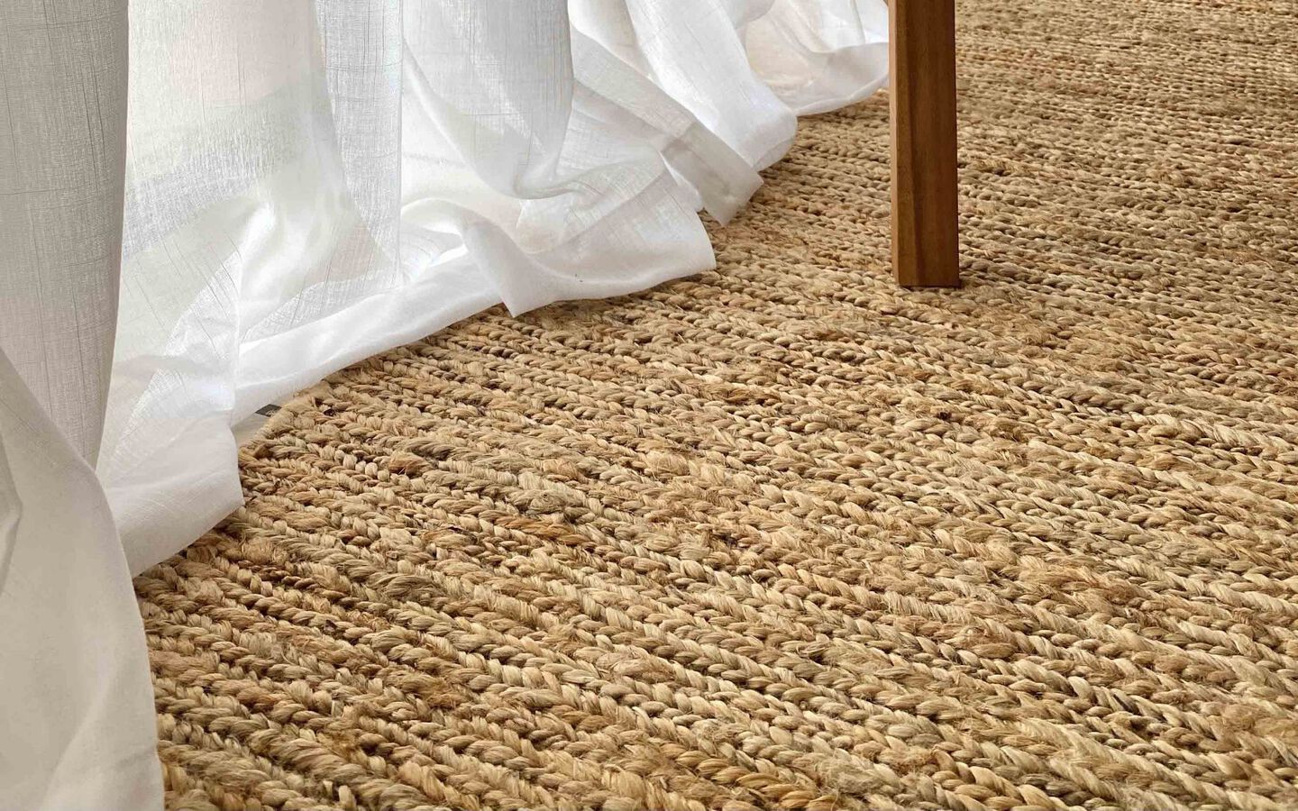 closeup image of a tan jute rug