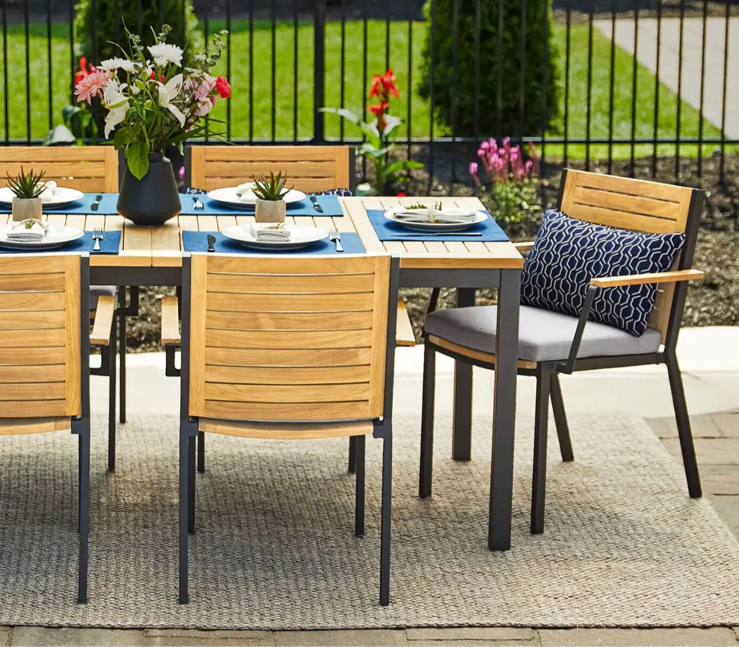 Wooden patio table and matching chairs with grey metal legs