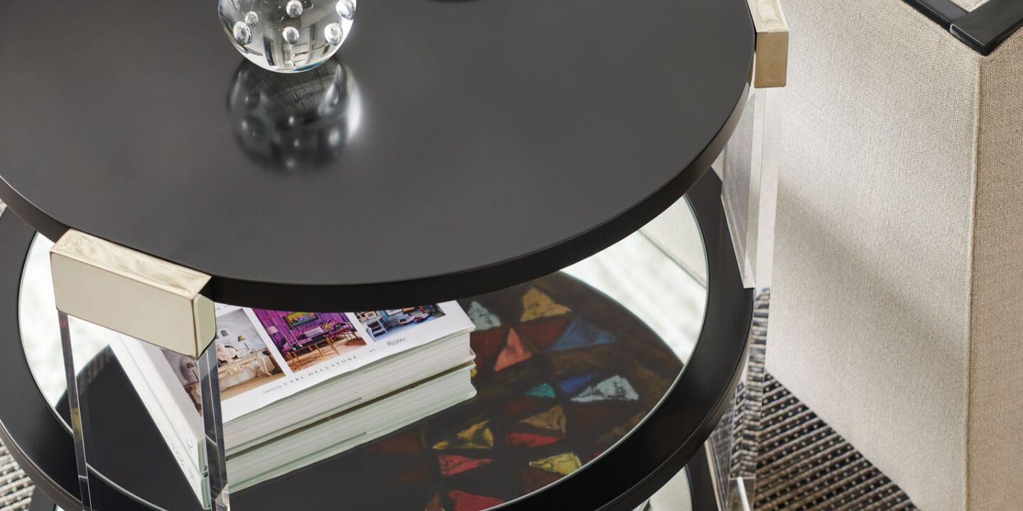 black coffee table with glass bottom and side panels
