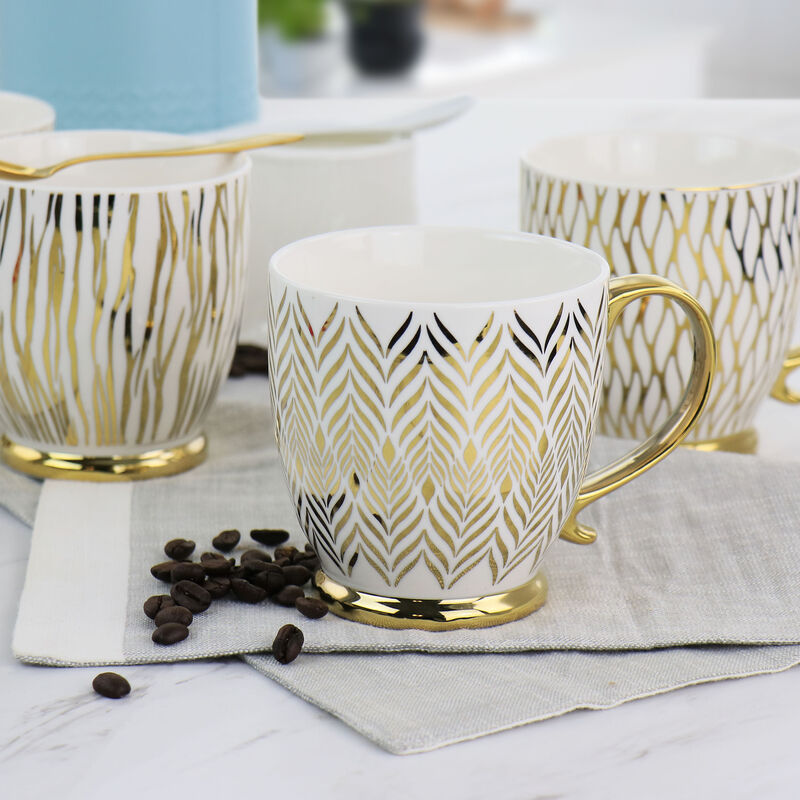 Gibson Home Gold Finch 4 Piece 16.7oz Electroplated Fine Ceramic Mug Set in Gold