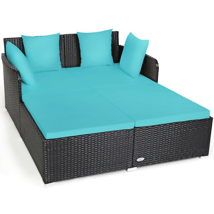 Outdoor Woven Rattan Daybed with Deep Cushions and Multiple Pillows