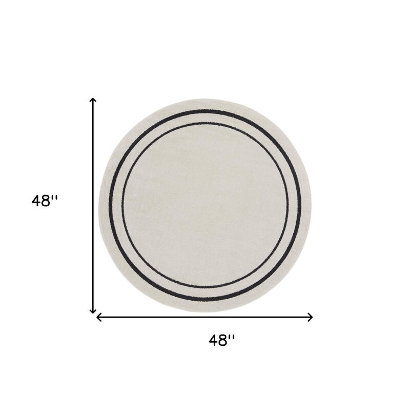 HomeRoots 4' Ivory And Black Round Indoor Outdoor Area Rug image number 4