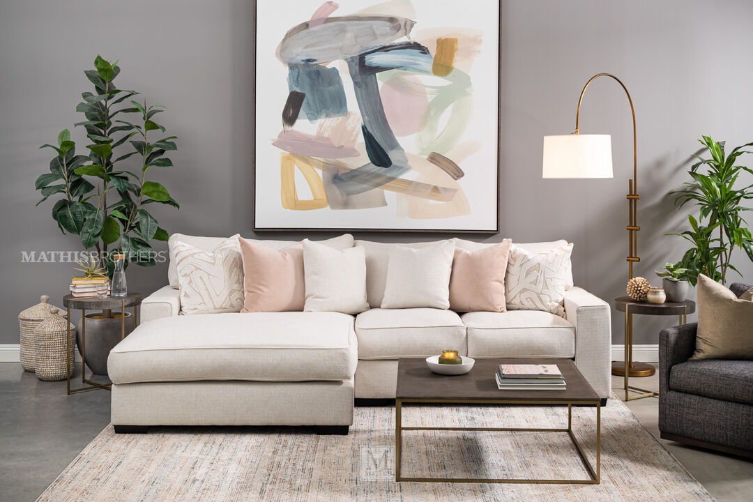 Michael Nicholas Troy Sofa with Chaise in white/cream in a contemporary grey toned living room setting.