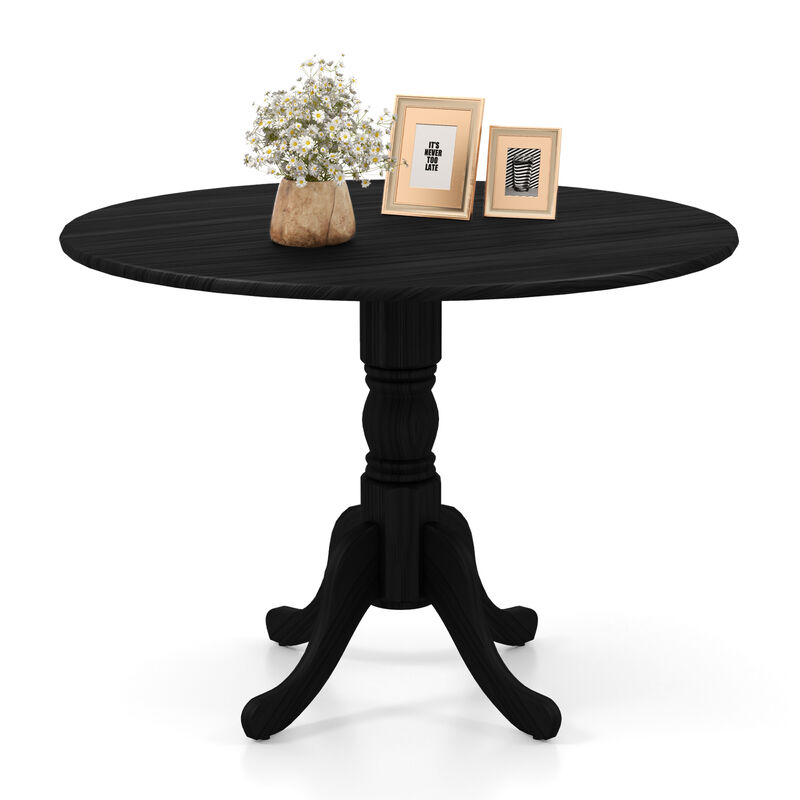 Wooden Dining Table with Round Tabletop and Curved Trestle Legs.