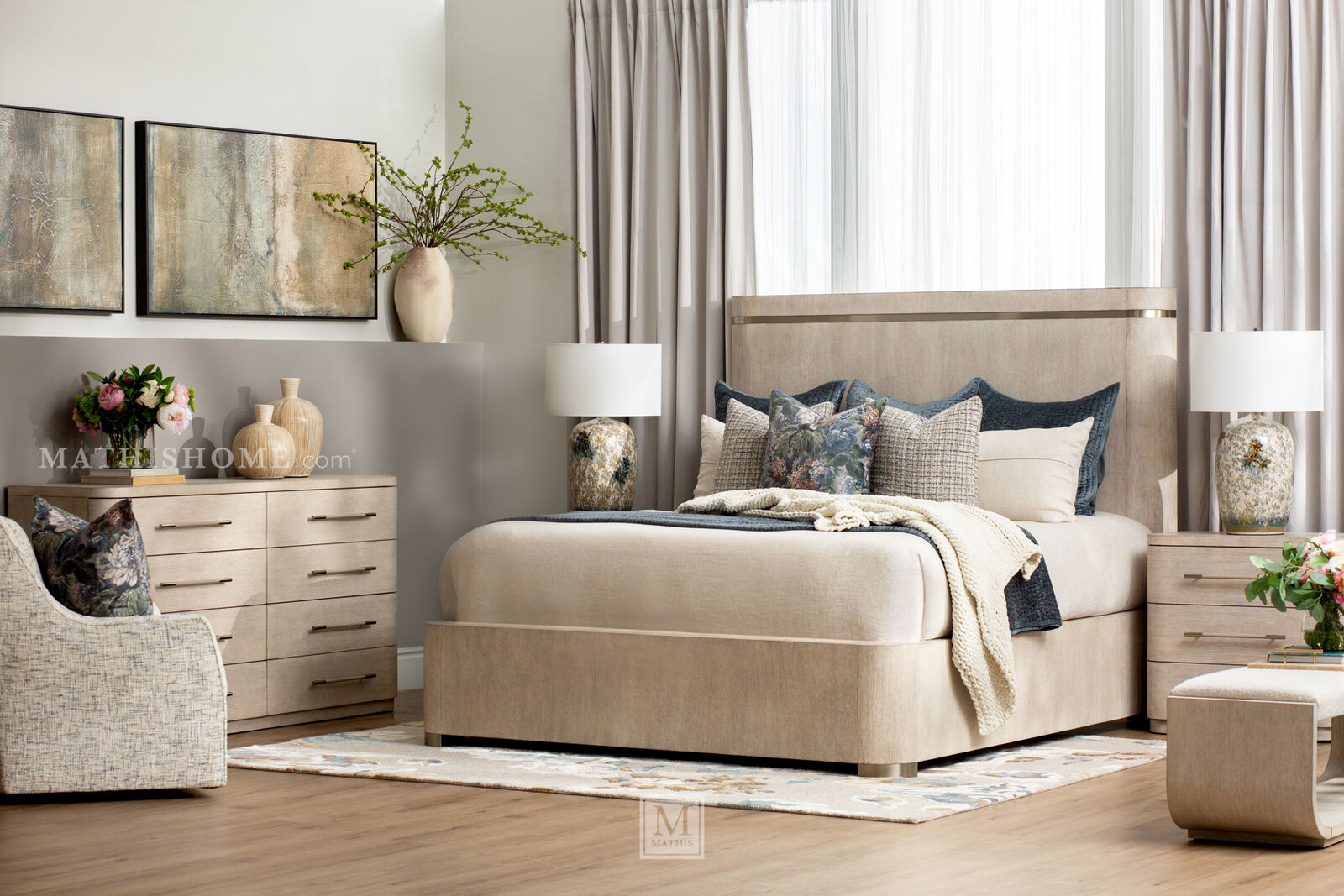 Wood panel bed with upholstered headboard, matching nightstands, and dresser in a styled bedroom