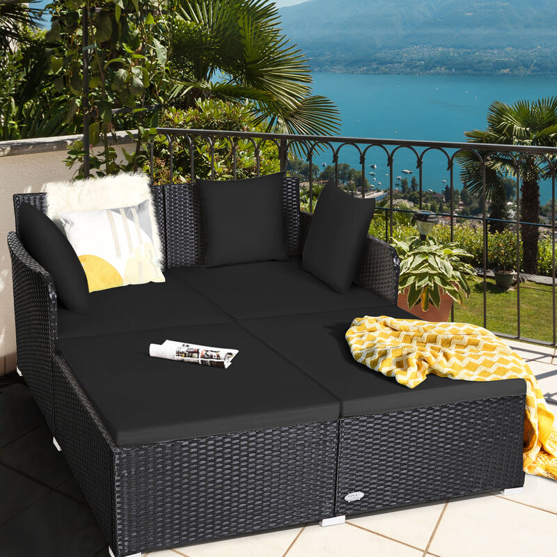 Outdoor Woven Rattan Daybed with Deep Cushions and Multiple Pillows