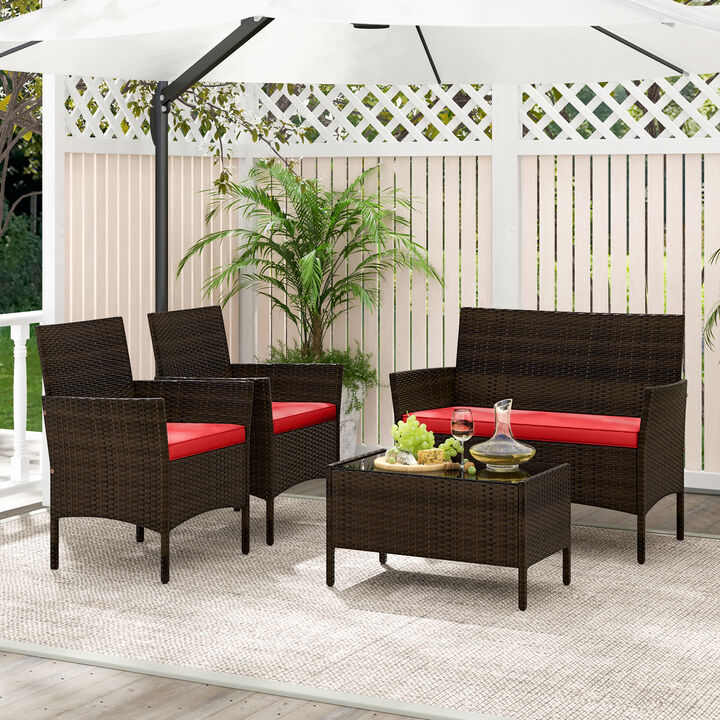 4-Piece Patio Rattan Conversation Set with Cushioned Seats and Tempered Glass Table