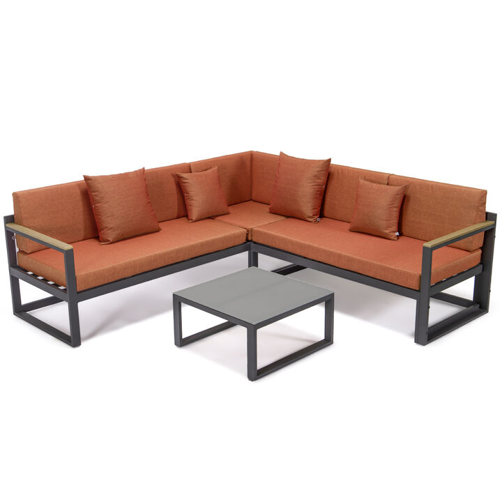 LeisureMod Chelsea Outdoor Black Sectional With Adjustable Headrest & Coffee Table With Cushions