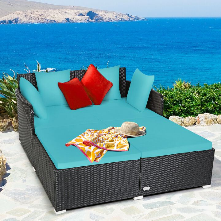 Outdoor Woven Rattan Daybed with Deep Cushions and Multiple Pillows