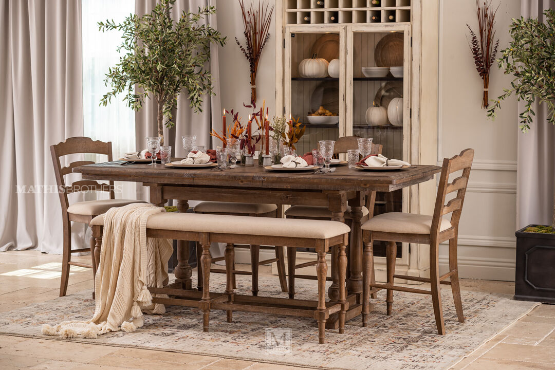 Augusta Tall Dining Table With Leaf with four chairs and one bench, in a dining room setting 