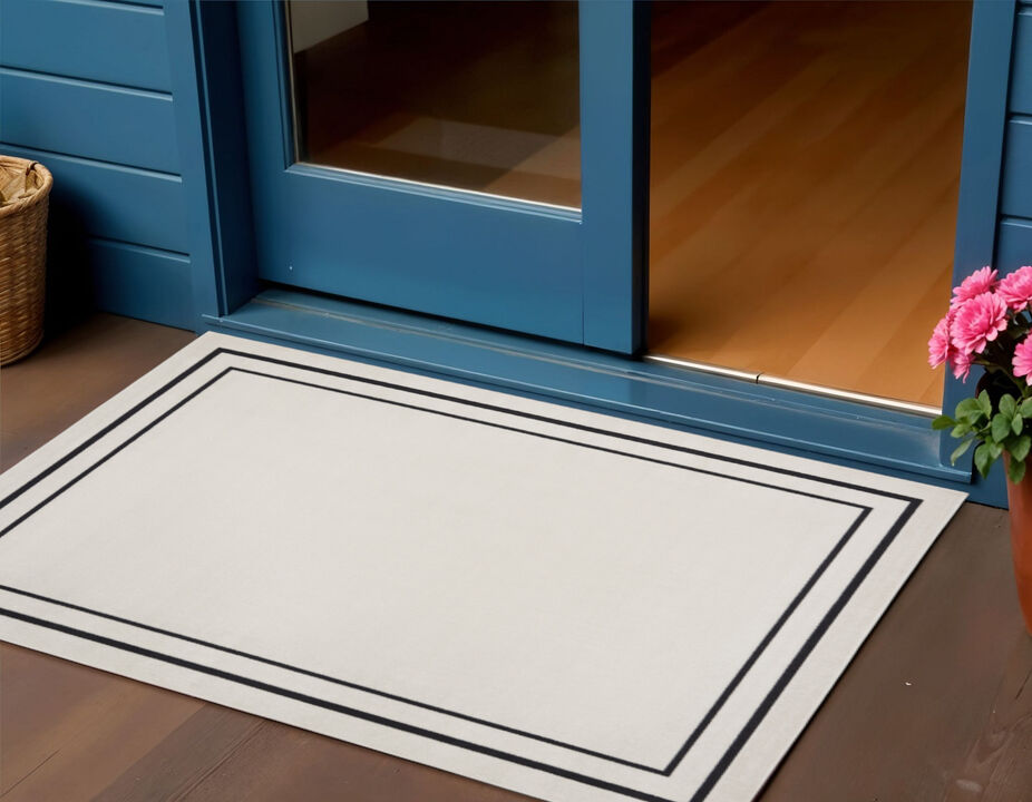 HomeRoots 2' X 4' Ivory And Black Indoor Outdoor Area Rug