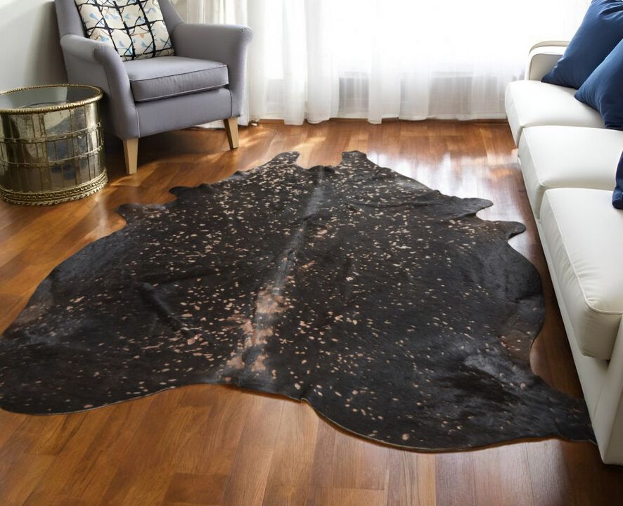 HomeRoots Cowhide Animal Print Power Loom Area Rug