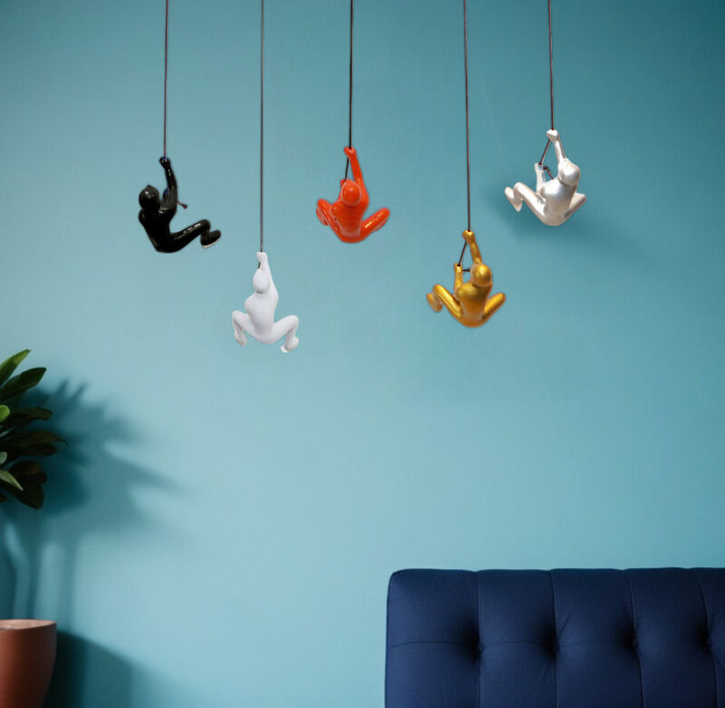 HomeRoots Set of Five Black Gold Orange Silver And White Resin Climbing Man Hanging Dimensional Sculpture image number 1