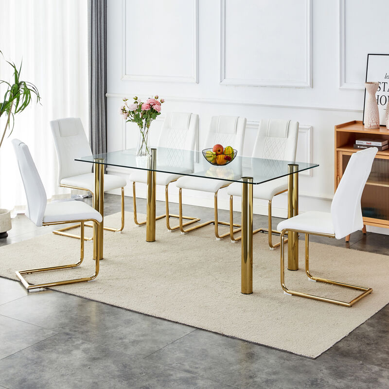 1 table with 6 chairs, transparent tempered glass tabletop, thickness 0.3 feet, golden metal legs, paired with white PU backrest cushion chair, golden plated metal legs.T003 C001