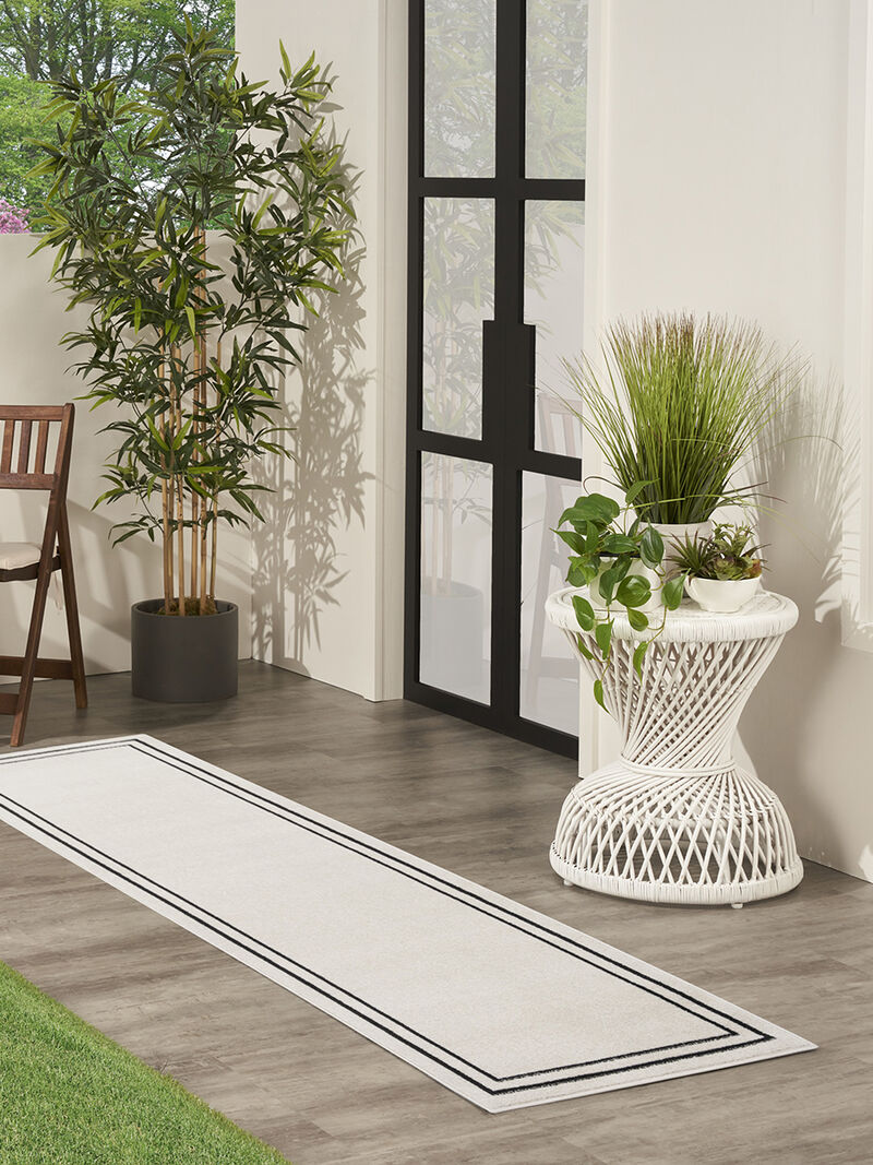 Nourison Essentials NRE02 Ivory/Black 2' x 6' Rug image number 1
