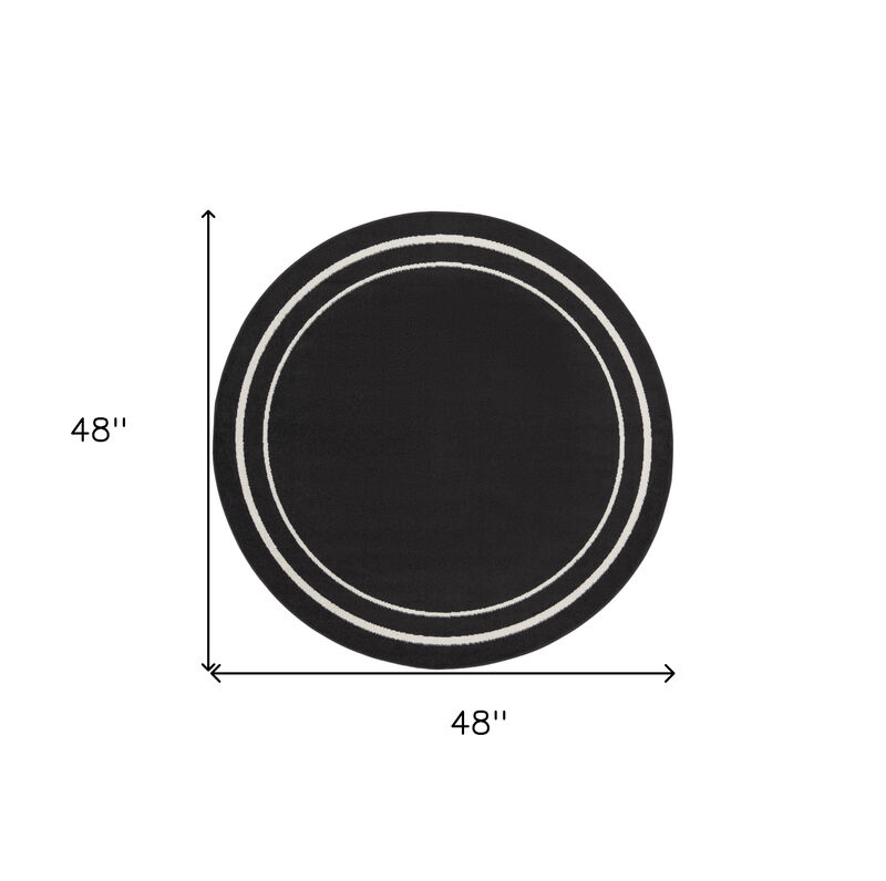 HomeRoots 4' Black And Ivory Round Indoor Outdoor Area Rug image number 4