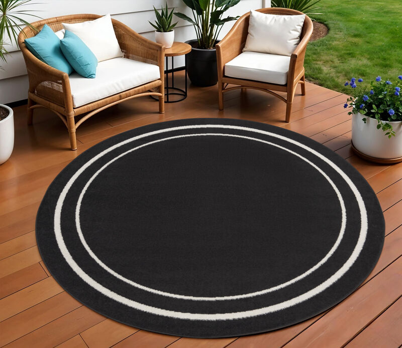 HomeRoots 8' Black And Ivory Round Indoor Outdoor Area Rug image number 1