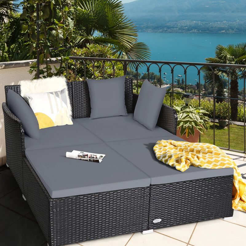 Mondawe Spacious Outdoor Rattan Daybed with Upholstered Cushions and Pillows