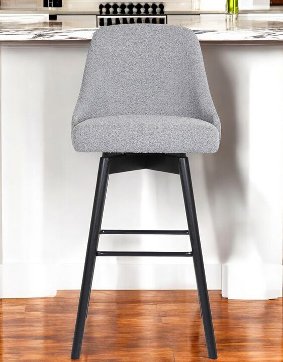 HomeRoots Solid Wood and Fabric Armless Swivel Bar Stool