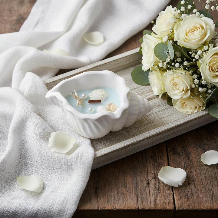 HomeRoots 6" Unscented Soy Wax Candle In White Resin Novelty Holder With Seashells