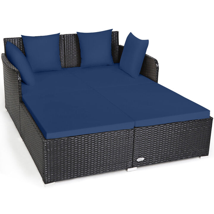 Spacious Outdoor Rattan Daybed with Upholstered Cushions and Pillows