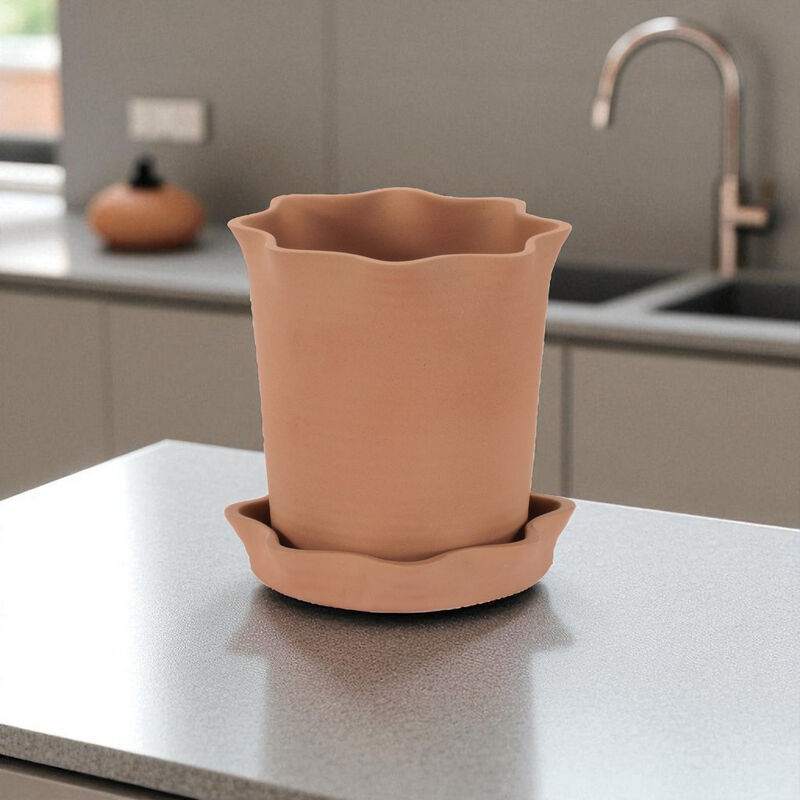 Textured Ceramic Planter with Wavy Design and Saucer for Modern Home Decor.
