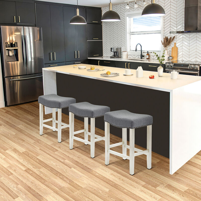 WestinTrends 24" Upholstered Saddle Seat Antique White Counter Stool (Set of 3)