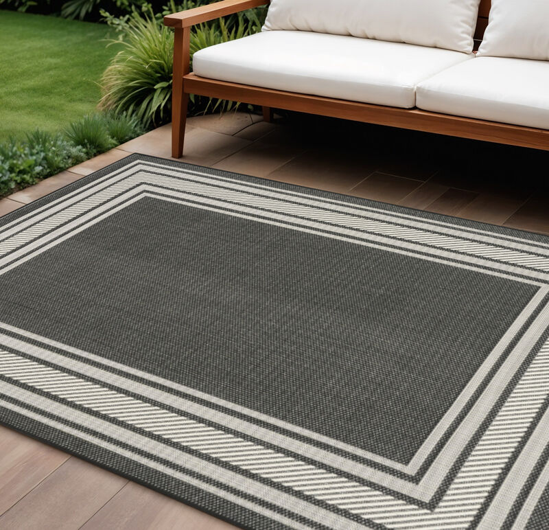 HomeRoots 6' X 9' Black Geometric Indoor Outdoor Area Rug image number 1