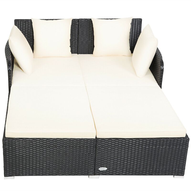 Spacious Outdoor Rattan Daybed with Upholstered Cushions and Pillows