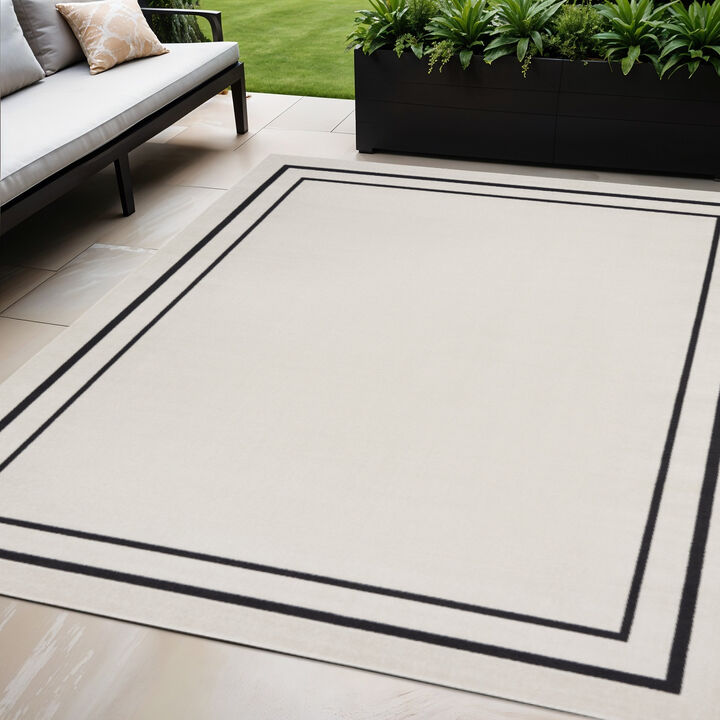 HomeRoots 5' X 7' Ivory And Black Indoor Outdoor Area Rug