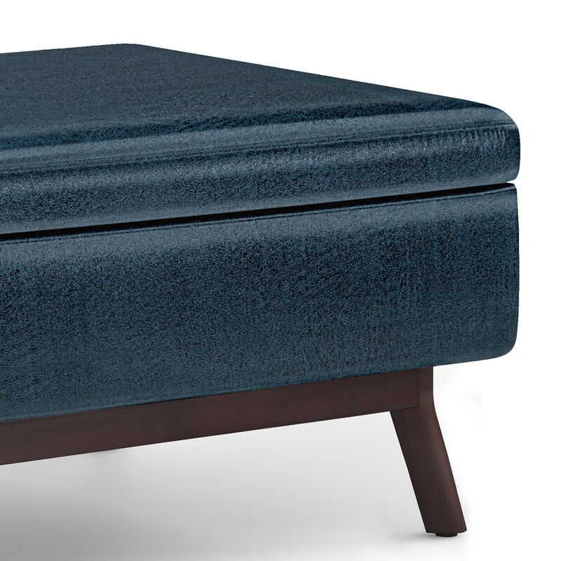Owen Coffee Table Storage Ottoman in Distressed Dark Blue Faux Leather