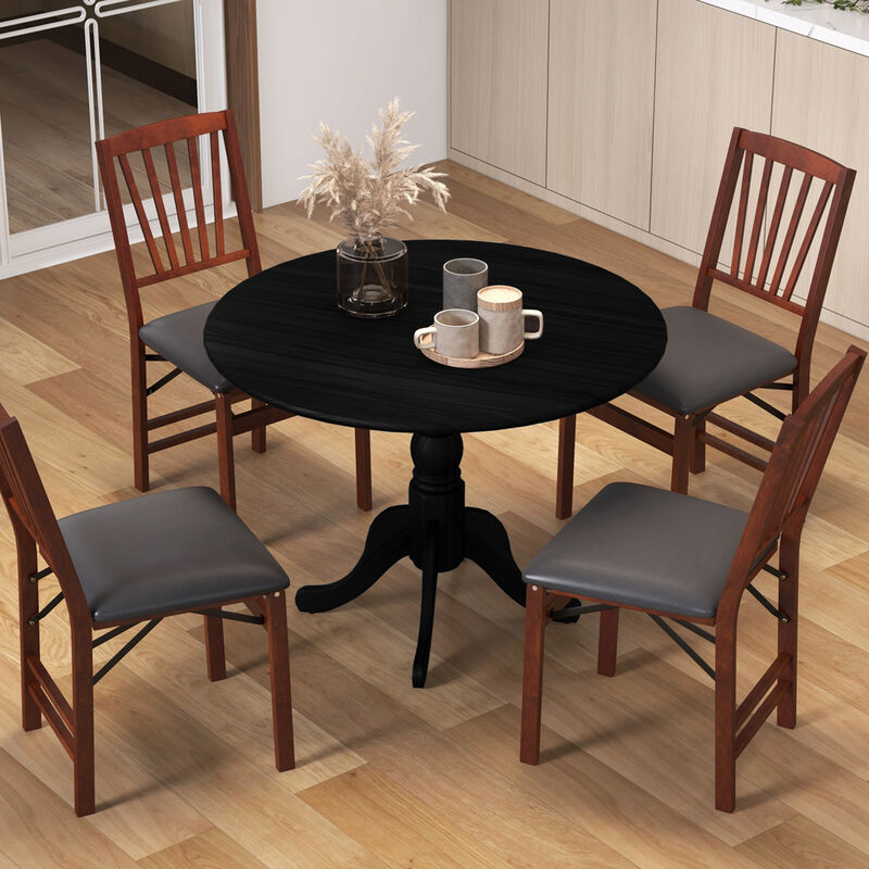 Wooden Dining Table with Round Tabletop and Curved Trestle Legs.