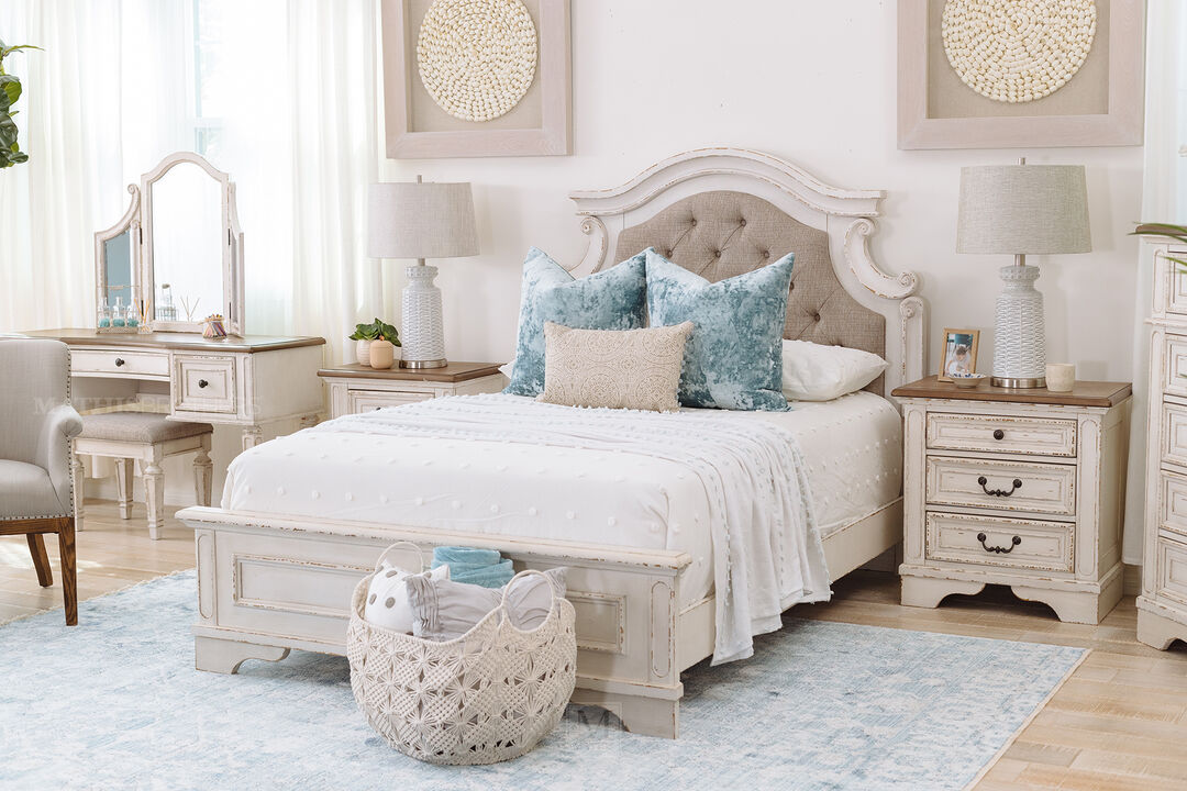 Ashley Realyn Three Drawer Nightstand - in a bedroom setting