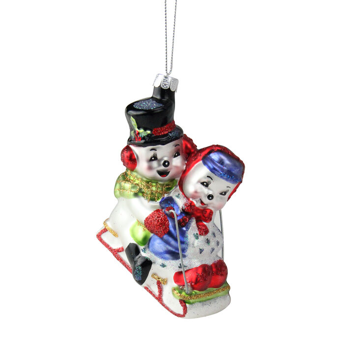 4.5" White and Red Cheerful Sledding Snowmen Couple Glass Christmas Ornament
