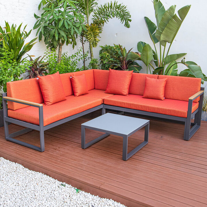 LeisureMod Chelsea Outdoor Black Sectional With Adjustable Headrest & Coffee Table With Cushions