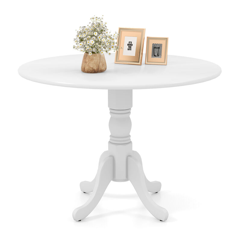 Wooden Dining Table with Round Tabletop and Curved Trestle Legs.