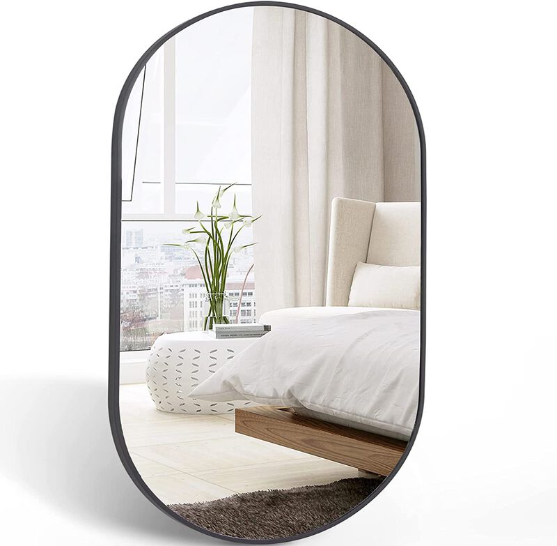 Elegant oval mirror with sleek frame &ndash; perfect for living room or entryway decor image number 0